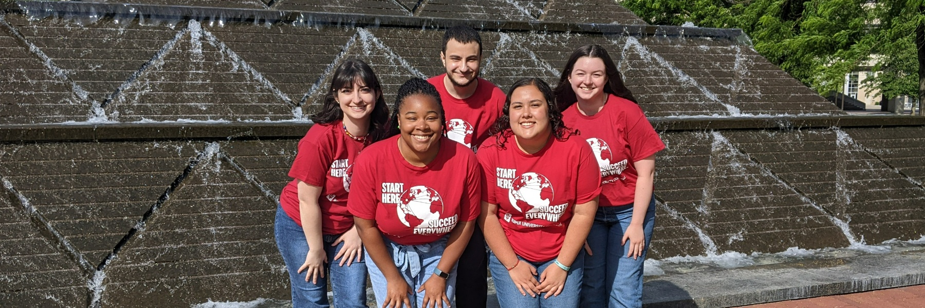 Photograph of the 5 peer advisors in front of the Wood fountain at IUPUI